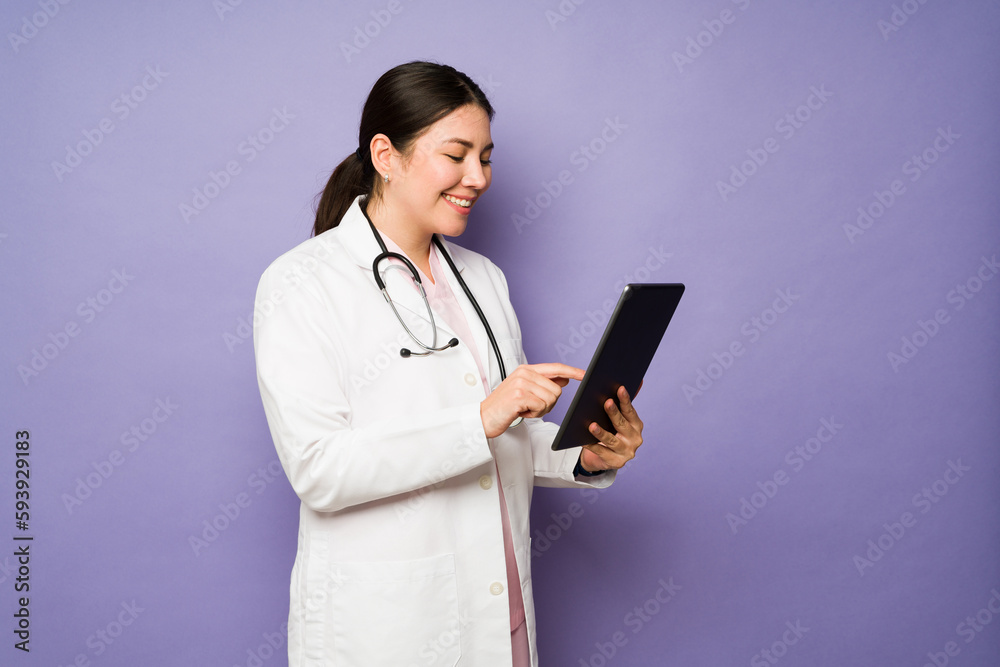 Professional female doctor working and smiling Professional female doctor working and smiling
