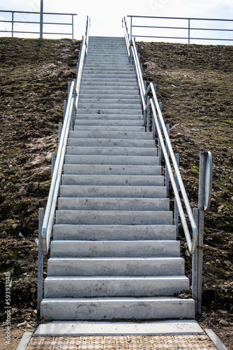 Fototapeta Naklejka Na Ścianę i Meble -  Concrete stairs leading up. Infrastructure and the concept of purposefulness and goals