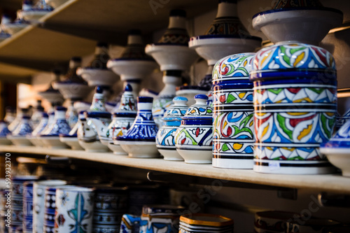 Traditional Moroccan handmade crafts plates and cups in Marrakech medina souvenir shop
