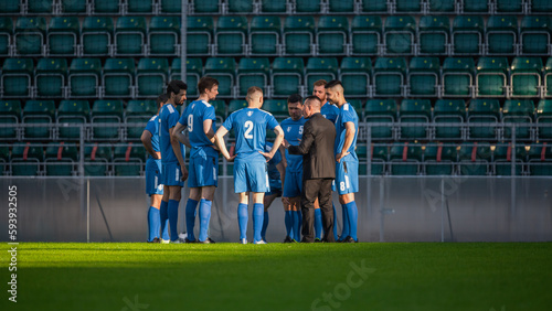 Professional Soccer Team Training  Tactical Coaching  Football Coach Explains Game Strategy  Tactics  Workout Plan to Players. Trainer Motivates Athletes  Leads to Victory  Preparing For Tournament