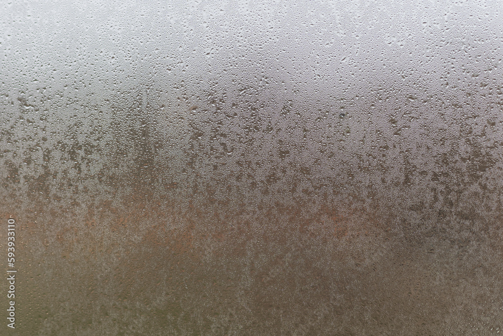 Water droplets condensation background of dew on glass, humidity and foggy blank. Outside, bad weather, rain Water droplets condensation background of dew on glass, humidity and foggy blank. Outside, bad weather, rain
