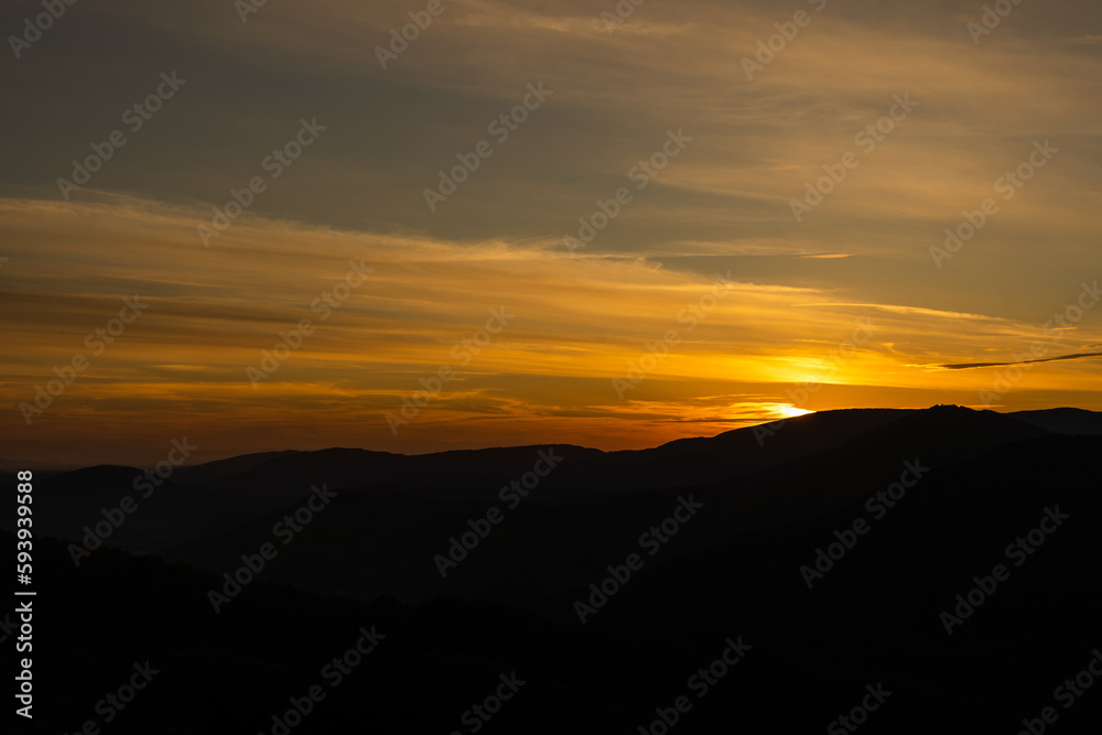 Sunset in mountains in summer landscape