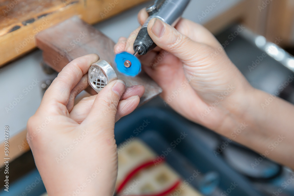 Fototapeta premium Factory for the production of jewelry, workers are making and polishing jewelry