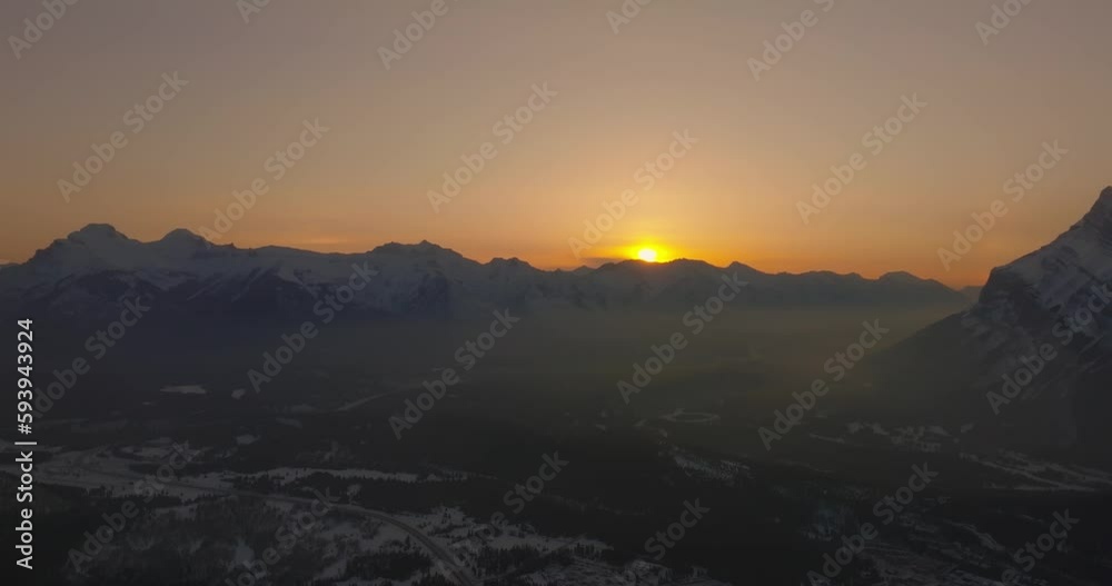 aerial view of Mount Rundle with galo from sun during sunrise aerial view of Mount Rundle with galo from sun during sunrise
