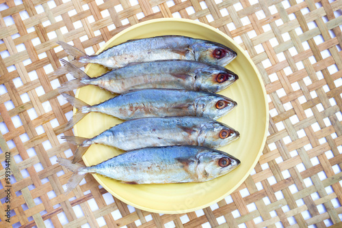 Salted fish on bamboo weave plate