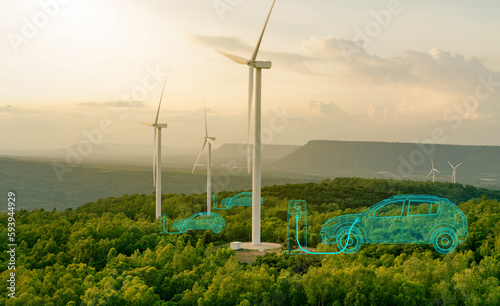 Sustainable energy for electric vehicle. EV car with electric vihicle charging station. Wind turbine farm. Renewable, sustainable energy. Green technology. Wind power. Sustainability transportation. photo