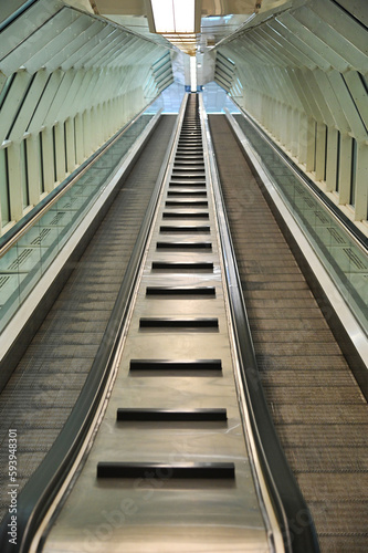 Fototapeta Naklejka Na Ścianę i Meble -  Deserted double way escalator tunnel perspective view