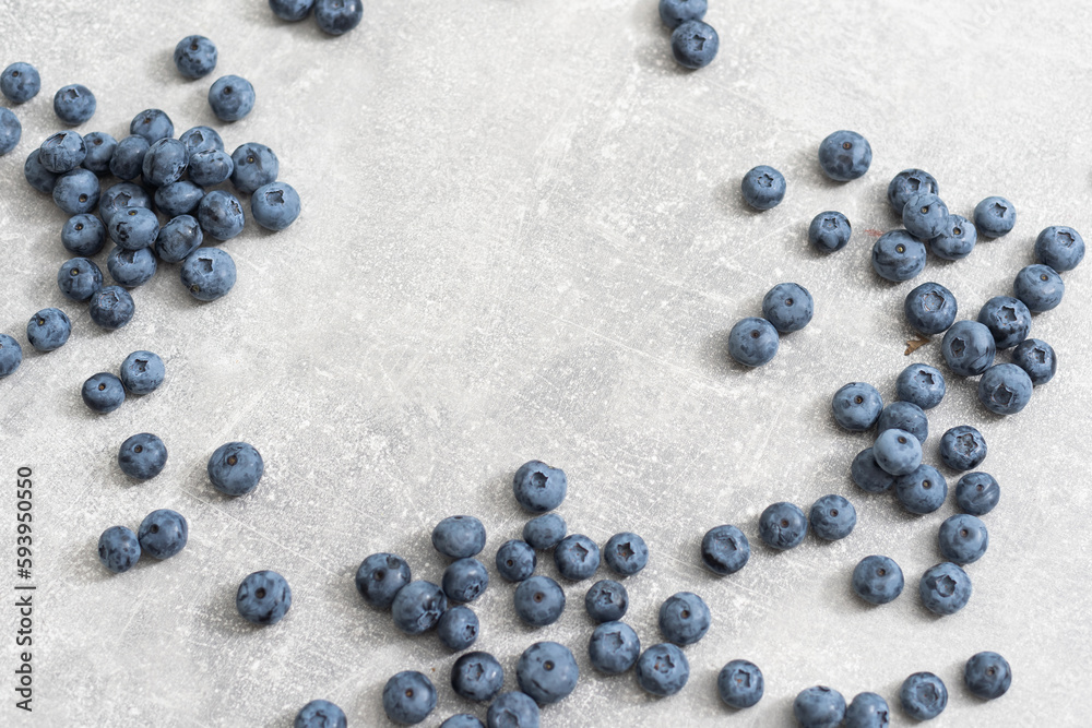 Top view of a group of fresh blueberries on gray background. Top view of a group of fresh blueberries on gray background.