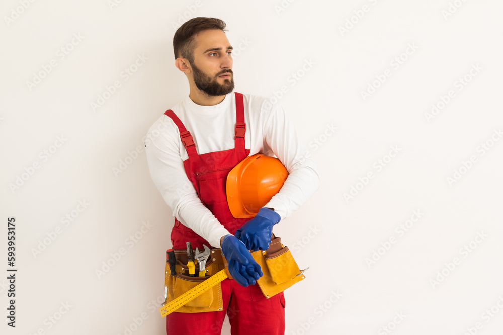 Male worker in a uniform posing isolated on white background Male worker in a uniform posing isolated on white background