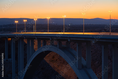 Fototapeta Naklejka Na Ścianę i Meble -  streetlights on the Maslenica bridge after sunset