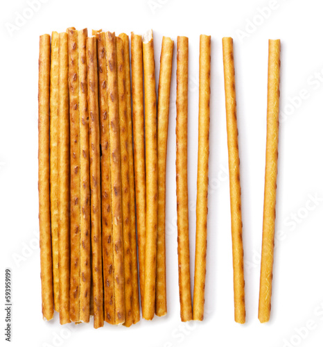 Pretzel sticks scattered on a white background. Top view