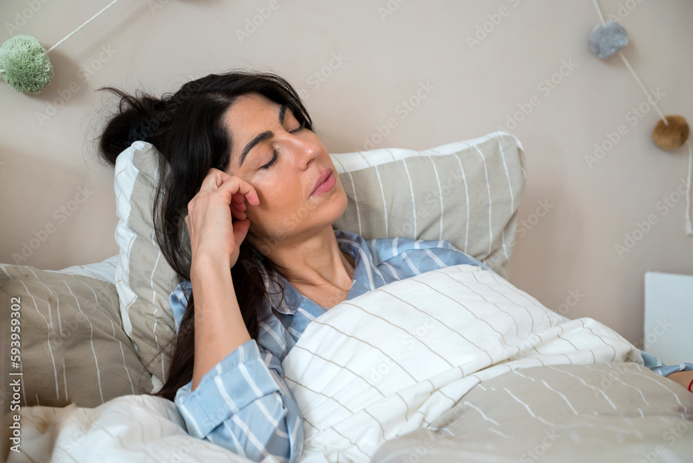 Woman Sleeping in Bed at Home Woman Sleeping in Bed at Home