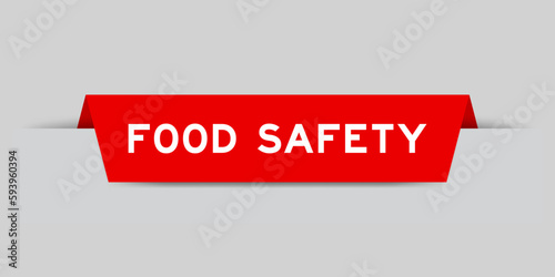 Red color inserted label with word food safety on gray background
