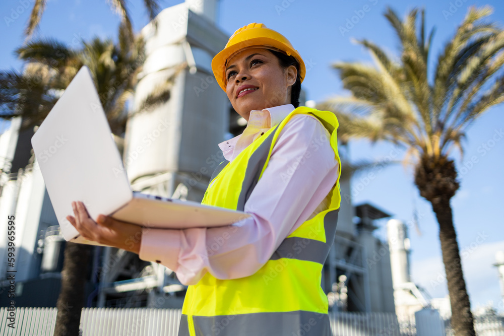 Black female engineering supervisor with laptop Black female engineering supervisor with laptop