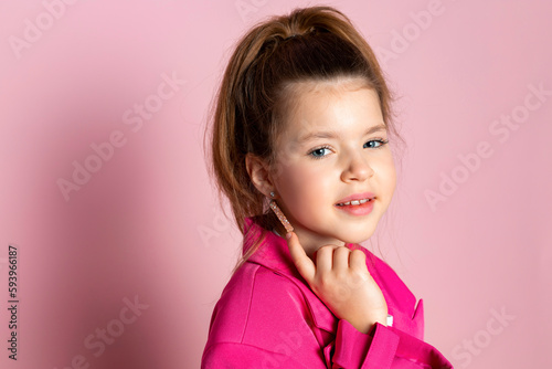 Принти на полотні Portrait of a little girl in an oversized pink blazer
