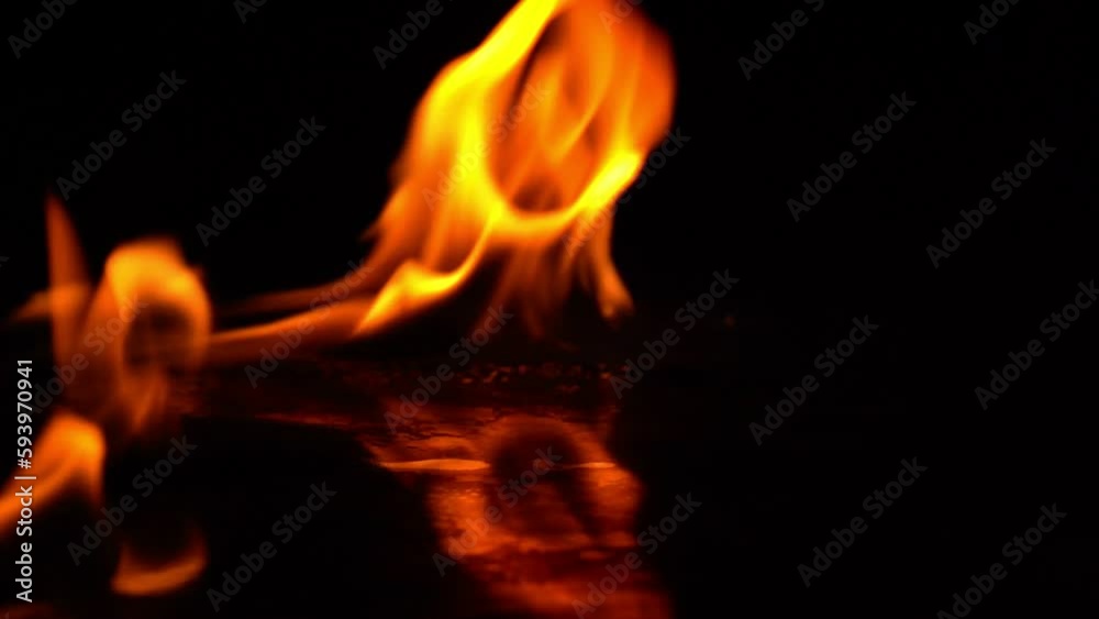 4K burning power of the flame, Flames and burning sparks close-up, fire patterns, the glow of fire in the dark 4K burning power of the flame, Flames and burning sparks close-up, fire patterns, the glow of fire in the dark