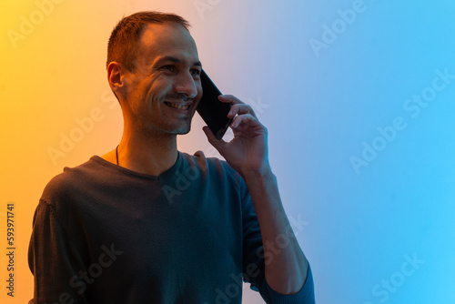 man with smartphone colored background photo