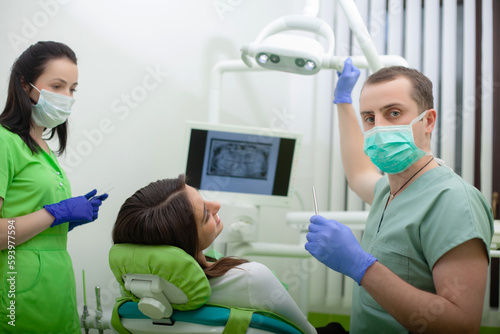 A woman having teeth examined at dentists