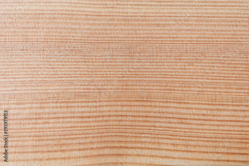 The fibers and texture of the wooden board, the polished surface.
