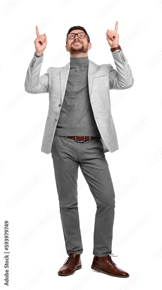 Handsome bearded businessman in eyeglasses pointing at something on white background Handsome bearded businessman in eyeglasses pointing at something on white background