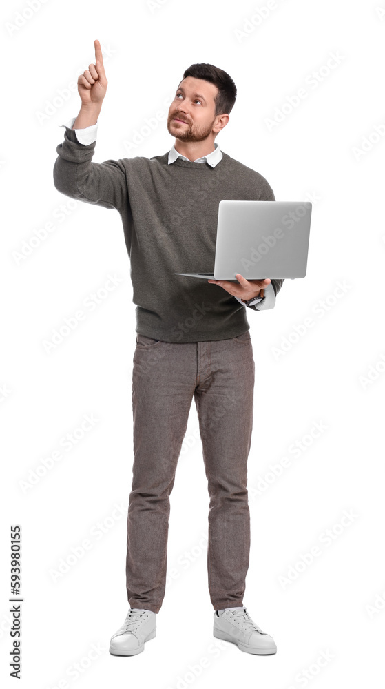 Handsome bearded businessman with laptop pointing at something on white background Handsome bearded businessman with laptop pointing at something on white background