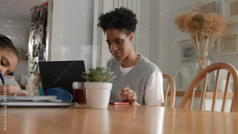 Mature black woman working from home on laptop Mature black woman working from home on laptop