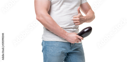 Man crop view giving thumb holding eggplant at crotch level imitating erect penis isolated on white photo