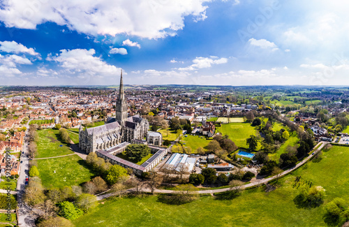 Aerial panorama of Salisbury Cathedral under a sunny blue sky	