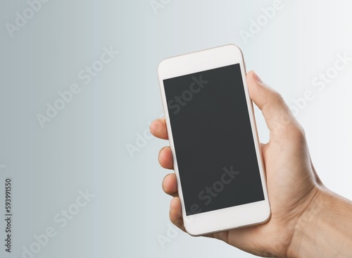 Hand holding phone with a blank screen