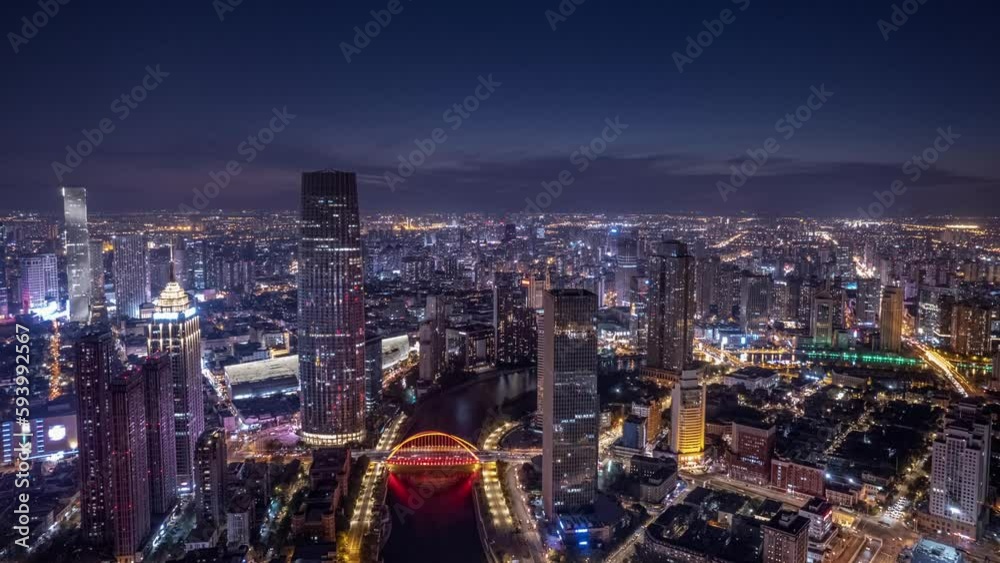 Drone hyper lapse of illuminated modern city at night