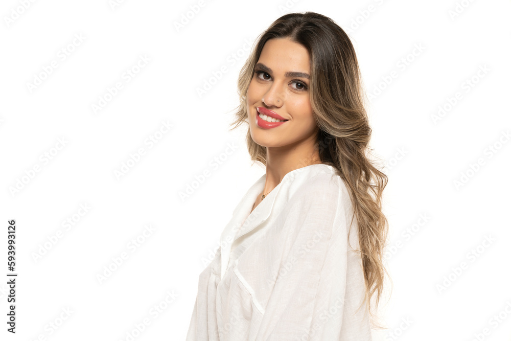 beautiful young happy women with makeup and long wavy hair on a white background. beautiful young happy women with makeup and long wavy hair on a white background.