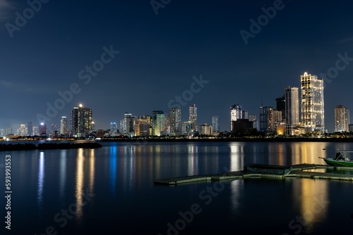 Manila bay at night in Philippines © Chrisdevillio/Wirestock Creators