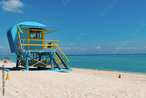 blue lifeguard at miami beach in summer, advertisement. lifeguard at miami beach vacation. © be free