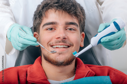 boy sitting smiling in dentist s office