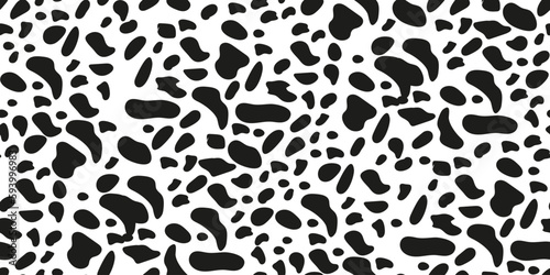 Seamless pattern with animal print dolmatian. Black spots. Suitable for printing and textiles.