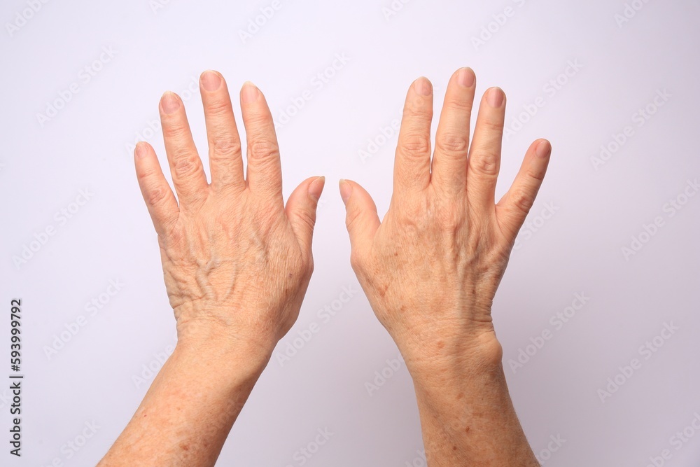 Closeup view of older woman's hands on white background - obrazy, fototapety, plakaty 