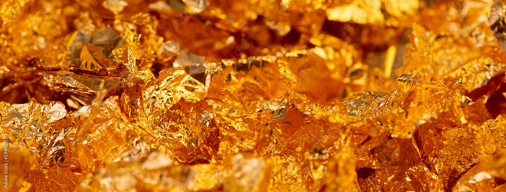 Golden texture background. Golden potal close-up glitters and shimmers. Golden holiday background. Golden texture background. Golden potal close-up glitters and shimmers. Golden holiday background.