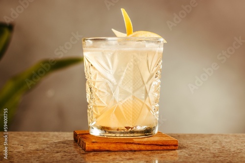 A closeup shot of a cocktail with a garnish