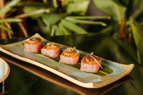 A plate with sushi and a blurred background