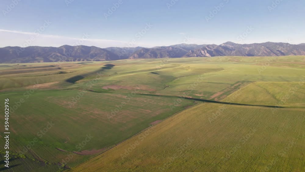Drone view of Swan Valley landscape with mountain and blue sky in Wyoming Drone view of Swan Valley landscape with mountain and blue sky in Wyoming