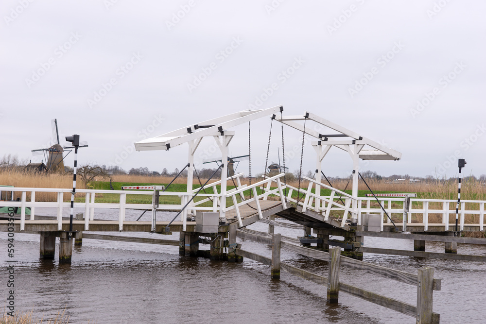 Wooden bridge across a canal in Kinderdijk. Holland