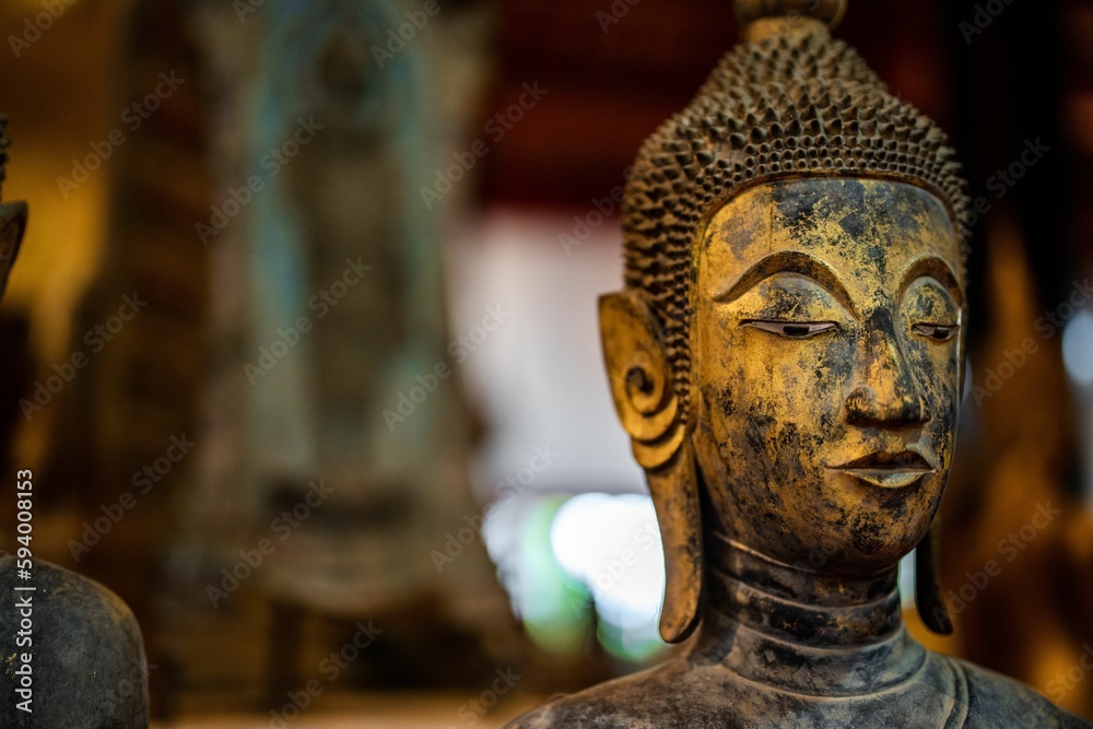 Ancient Buddha statue at Wat Visoun in Luang Prabang, Laos, Southeast Asia