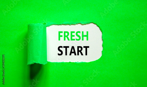 Fresh start and motivational symbol. Concept words Fresh start on beautiful white paper. Beautiful green table green background. Business motivational and Fresh start concept. Copy space.