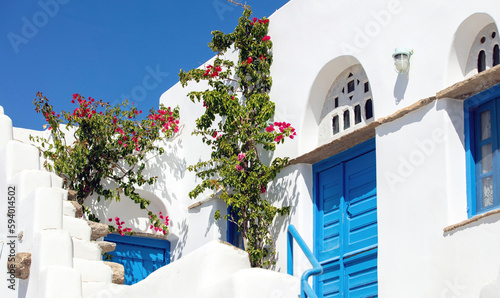 Tinos island Greece. Cycladic architecture at Volax village. Marble lintels, pink bougainvillea,