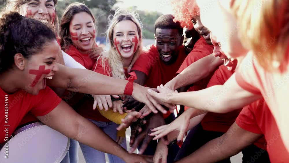 Crowd Red sport football fans celebrating final champion on stadium - Soccer hooligans stacking hands during match game