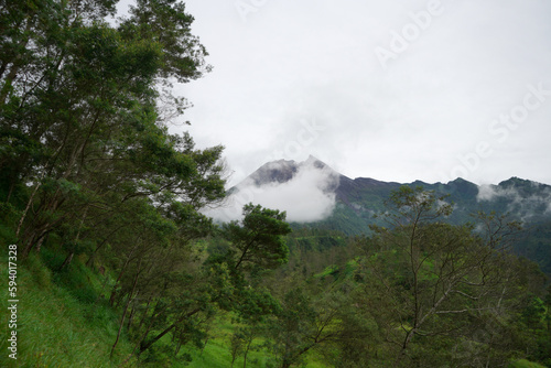 Wallpaper Mural Mount Merapi, which is dashing and beautiful, is slightly covered with white clouds Torontodigital.ca