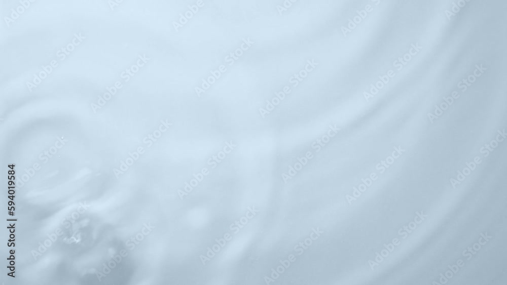 Drop of water falling down and making circles on surface. Slow motion. Closeup Drop of water falling down and making circles on surface. Slow motion. Closeup