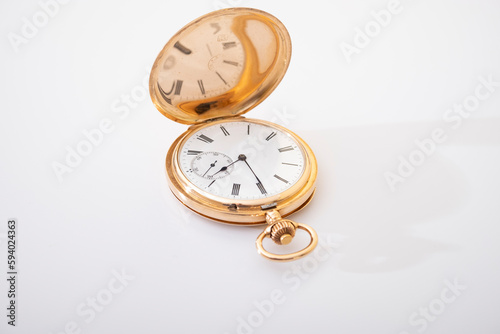 vintage gold pocket watch longines isolated on white background