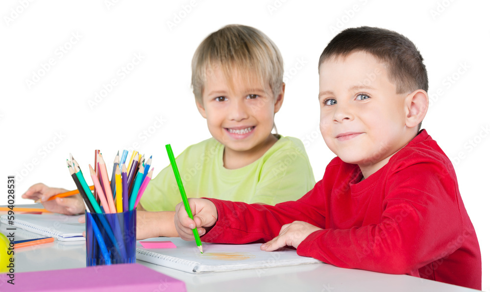 Two Smiling School Children Drawing on Notebooks Two Smiling School Children Drawing on Notebooks