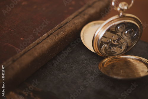 vintage gold pocket watch longines isolated on white background